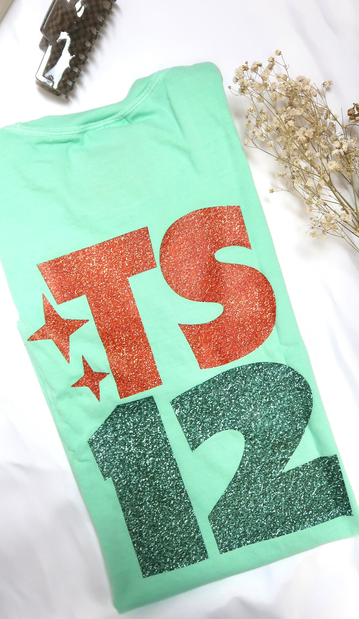 TS12: Showgirl Tee